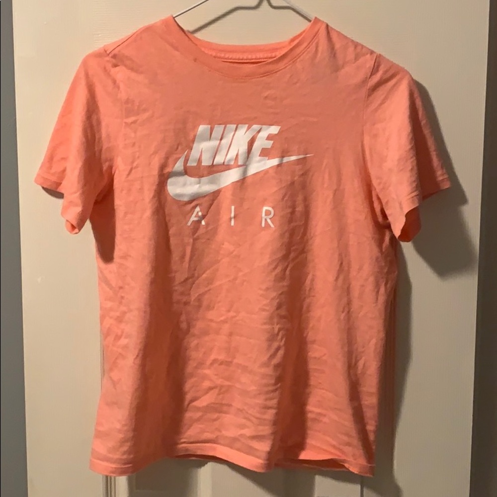 Peach Nike shirt